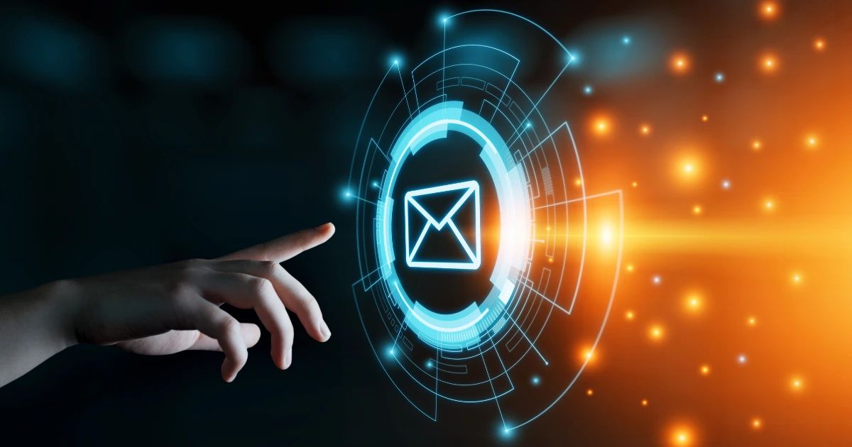 A hand pointing toward a glowing blue digital email envelope icon with circular tech rings on dark background
